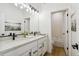 Modern bathroom with double vanity and soaking tub at 42960 Colonial Trl, Elizabeth, CO 80107