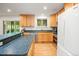 Updated kitchen featuring wood cabinets, sleek appliances, and ample counter space at 1005 W 7Th Ave Dr, Broomfield, CO 80020