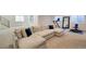 Finished basement with sectional sofa and home gym at 4224 E Dickenson Pl, Denver, CO 80222