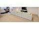 Finished basement with sectional sofa and home gym at 4224 E Dickenson Pl, Denver, CO 80222