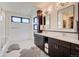 Elegant bathroom with double vanity, large shower, and modern fixtures at 4224 E Dickenson Pl, Denver, CO 80222
