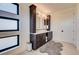 Bathroom with double vanity and dark brown cabinets at 4224 E Dickenson Pl, Denver, CO 80222