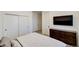 Comfortable bedroom with built-in closet and dresser at 4224 E Dickenson Pl, Denver, CO 80222