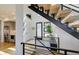 Modern entryway with a staircase and natural light at 4224 E Dickenson Pl, Denver, CO 80222