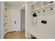 Clean entryway with built-in bench, shelving, and coat hooks at 4224 E Dickenson Pl, Denver, CO 80222