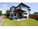 Two-story modern home with backyard patio and fenced yard at 4224 E Dickenson Pl, Denver, CO 80222