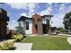 Contemporary two-story house with a combination of wood and light-colored siding at 4224 E Dickenson Pl, Denver, CO 80222