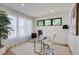 Spacious home office with large windows and a glass desk at 4224 E Dickenson Pl, Denver, CO 80222