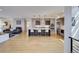 Open concept kitchen with island, stainless steel appliances, and light wood floors at 4224 E Dickenson Pl, Denver, CO 80222