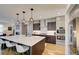 Modern kitchen with stainless steel appliances and a large island at 4224 E Dickenson Pl, Denver, CO 80222