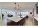 Modern kitchen island with white quartz countertop and dark cabinetry at 4224 E Dickenson Pl, Denver, CO 80222