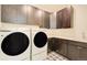 Convenient laundry room with washer, dryer, and ample storage at 4224 E Dickenson Pl, Denver, CO 80222