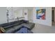 Relaxing living area with sectional sofa and large artwork at 4224 E Dickenson Pl, Denver, CO 80222