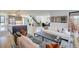 Spacious living room with hardwood floors, white sofa, and modern fireplace at 4224 E Dickenson Pl, Denver, CO 80222
