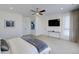 Main bedroom with a large TV and plenty of natural light at 4224 E Dickenson Pl, Denver, CO 80222