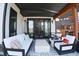 Covered patio with comfortable seating and outdoor heater at 4224 E Dickenson Pl, Denver, CO 80222