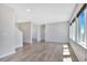 Spacious living room with wood-look floors and neutral walls at 14382 Mosaic Ave, Parker, CO 80134