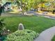 Landscaped front yard with large tree and lawn at 2789 S Ivan Way, Denver, CO 80227