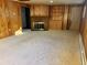 Spacious basement with a fireplace and built-in shelving at 2789 S Ivan Way, Denver, CO 80227