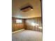 Basement bedroom with wood paneling and window at 2789 S Ivan Way, Denver, CO 80227