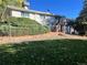 Brick patio, deck, and fenced backyard at 2789 S Ivan Way, Denver, CO 80227