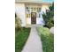 Inviting front entry with security door and landscaping at 2789 S Ivan Way, Denver, CO 80227