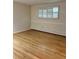 Living room with hardwood floors and window shutters at 2789 S Ivan Way, Denver, CO 80227