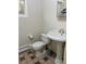 Bathroom with pedestal sink and tiled floor at 2789 S Ivan Way, Denver, CO 80227