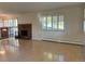 Bright living room featuring hardwood floors, a brick fireplace, and large windows at 2789 S Ivan Way, Denver, CO 80227