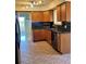 Kitchen boasts wood cabinets, granite countertops, and a dishwasher at 2789 S Ivan Way, Denver, CO 80227