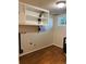 Laundry room with overhead cabinets and vinyl flooring at 2789 S Ivan Way, Denver, CO 80227