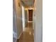 Long hallway with hardwood floors and built-in storage at 2789 S Ivan Way, Denver, CO 80227