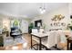 Spacious living room with hardwood floors, open to the kitchen and dining area at 1811 S Quebec Way # 134, Denver, CO 80231