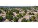 Aerial view of a townhome community with a pool and lush landscaping at 1811 S Quebec Way # 134, Denver, CO 80231