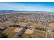 Aerial view of house near park and mountains at 2048 Spencer St, Longmont, CO 80501