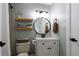 Modern bathroom with white subway tile shower and floating shelves at 2048 Spencer St, Longmont, CO 80501