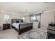 Main bedroom with a sleigh bed, chandelier, and plush carpeting at 2627 Hillcroft Ln, Castle Rock, CO 80104