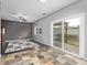 Dining area with slate floor, access to backyard, and ceiling fan at 3869 S Himalaya Way, Aurora, CO 80013