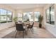 Bright dining room with hardwood floors and large windows at 11442 Autumn Moon St, Littleton, CO 80125