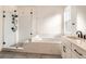 Spa-like bathroom with soaking tub, walk-in shower, and double vanity at 11442 Autumn Moon St, Littleton, CO 80125