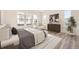 Spacious bedroom with large windows, hardwood floors and plenty of natural light at 11442 Autumn Moon St, Littleton, CO 80125