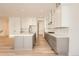 Modern kitchen with gray and white cabinets and large island at 11442 Autumn Moon St, Littleton, CO 80125