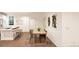 Light and bright dining area with wood table and chairs, adjacent to kitchen at , Aurora, CO 80019