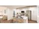 Modern kitchen features island with seating, stainless steel appliances, and ample cabinet space at , Aurora, CO 80019