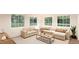 Spacious living room with comfortable sectional sofa and large windows at , Aurora, CO 80019