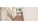 View down a stairwell showing access to lower level living space at , Aurora, CO 80019