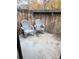 Private patio with two gray chairs and a small table at 6465 Welch St, Arvada, CO 80004