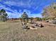 Backyard with firepit and gazebo under a blue sky at 371 S Estes St # 10, Lakewood, CO 80226