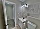 Clean bathroom with vanity, toilet, and access to a closet at 371 S Estes St # 10, Lakewood, CO 80226