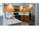 Modern kitchen featuring stainless steel appliances and white cabinets at 2542 S Bahama Cir # D, Aurora, CO 80013